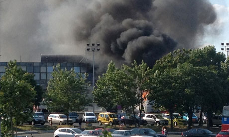 Smoke rises from a coach near Burgas airport, 250 miles east of Sofia in Bulgaria. Israel has blamed Iran for ordering a bomb attack on the coach, which was part of a convoy carrying an Israeli tour group to their hotels